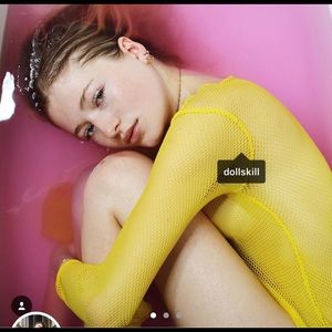 dolls kill yellow fishnet top